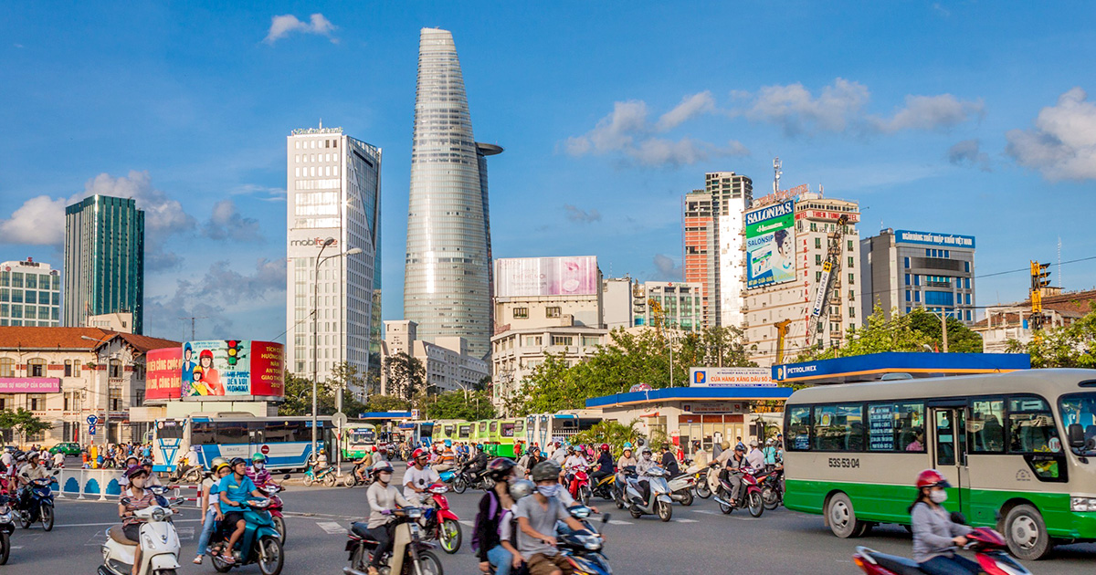 Busy street in Vietnam with cars and motorbikes